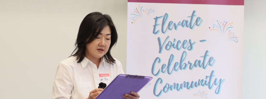 Woman reading poetry at a workshop